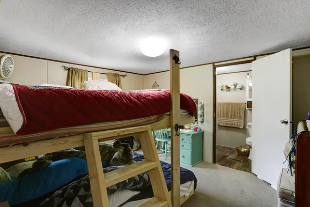 a bedroom with furniture and a bed