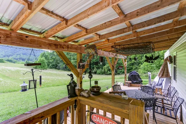 a view of a patio with couple of chairs
