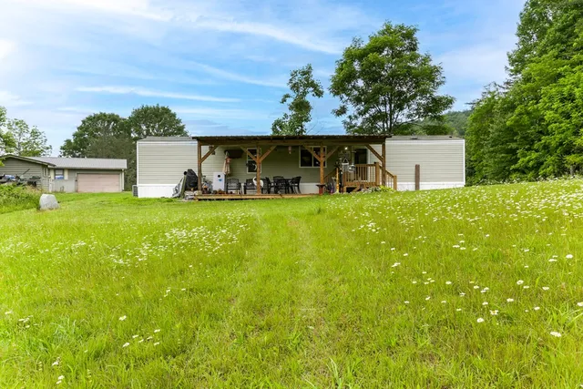 a view of a back yard of the house