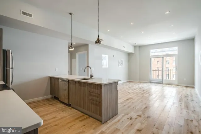 a view of a kitchen with sink and dishwasher