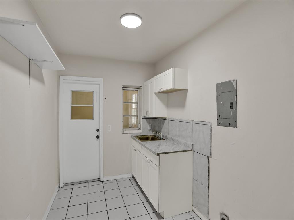 535 Northwest 91st Street, Unit 2 Miami, FL 33150 - Photo 11 of 20 a bathroom with a sink a vanity and mirror