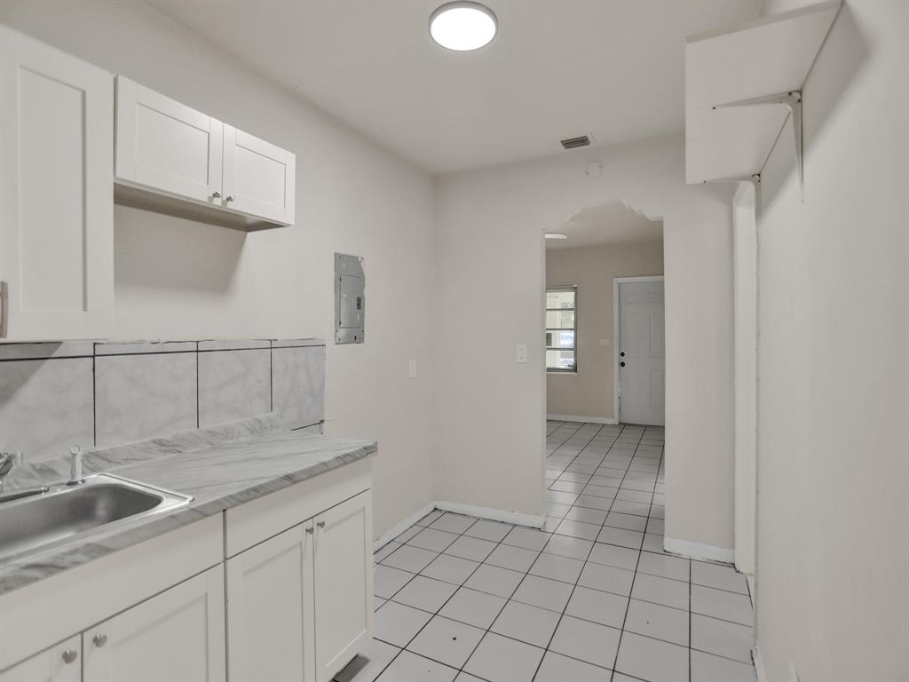 535 Northwest 91st Street, Unit 2 Miami, FL 33150 - Photo 13 of 20 a kitchen with sink and cabinets