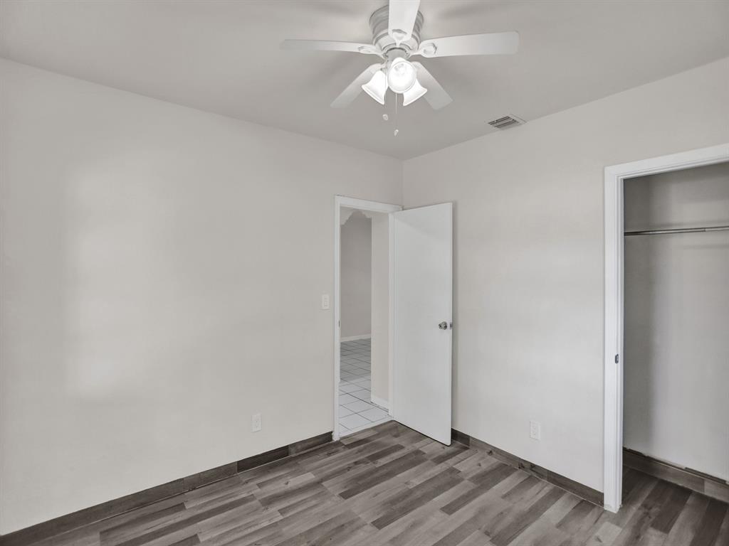 535 Northwest 91st Street, Unit 2 Miami, FL 33150 - Photo 17 of 20 a view of an empty room with wooden floor