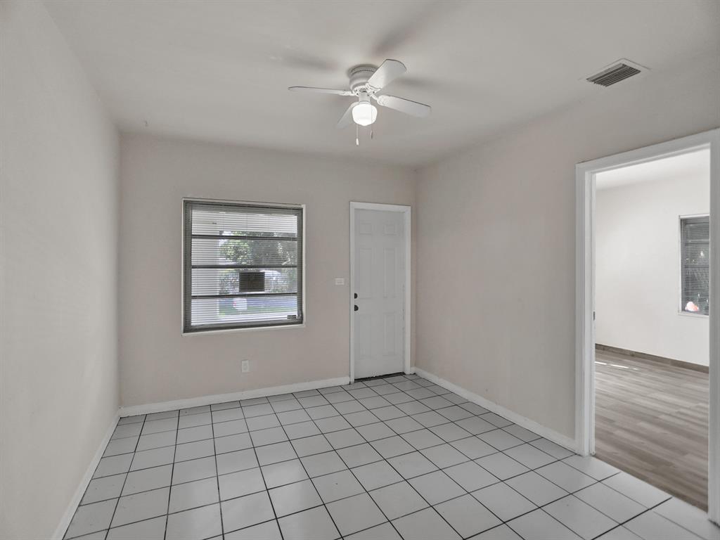 535 Northwest 91st Street, Unit 2 Miami, FL 33150 - Photo 2 of 20 a view of an empty room and window