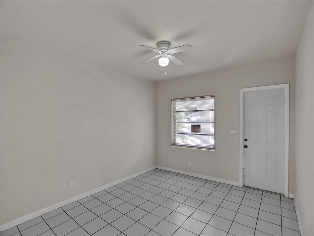 535 Northwest 91st Street, Unit 2 Miami, FL 33150 - Photo 3 of 20 a view of an empty room and window