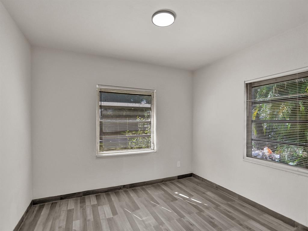 535 Northwest 91st Street, Unit 2 Miami, FL 33150 - Photo 8 of 20 an empty room with a window