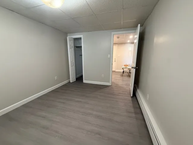 a view of hallway with wooden floor