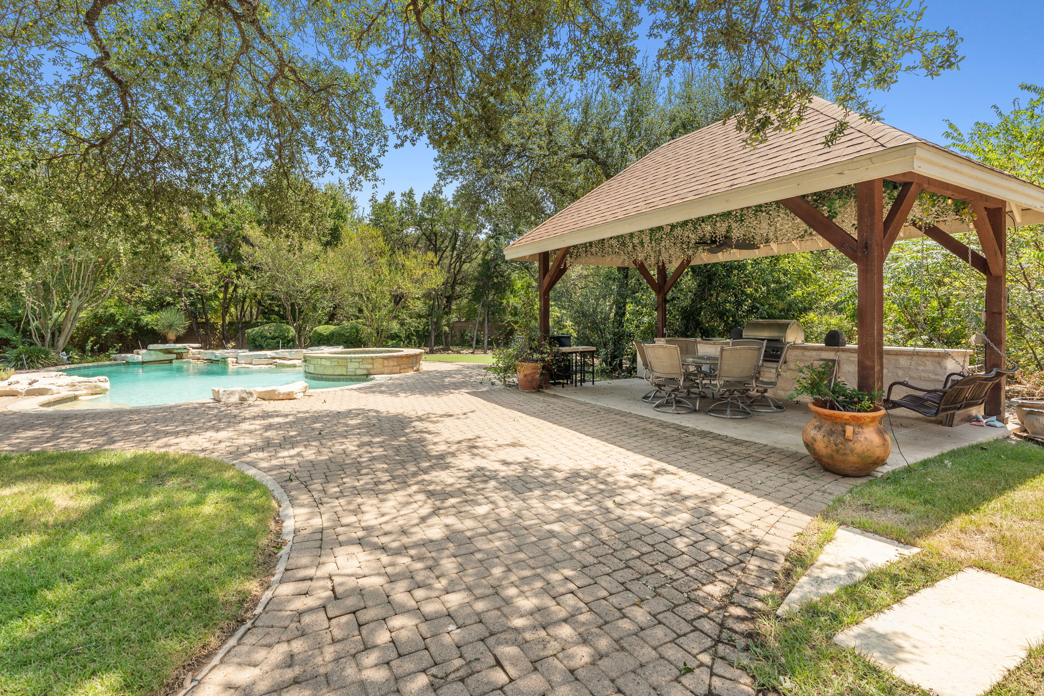 10503 Foundation Road Austin, TX 78726 - Photo 31 of 40 Pool pavilion with outdoor kitchen and covered dining area
