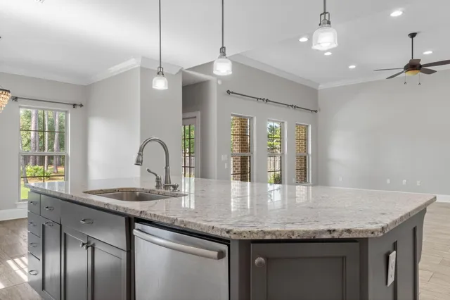 a view of an empty room and a bathroom