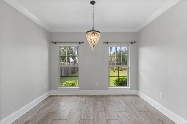 a view of a livingroom with a ceiling fan and window