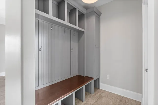 an empty room with a ceiling fan and a window