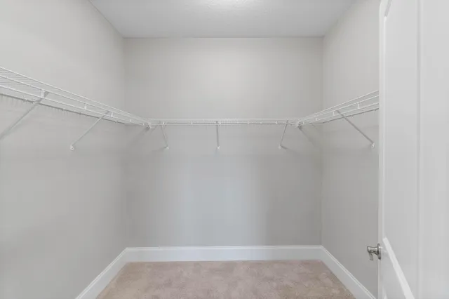 a view of an empty room with a cabinet