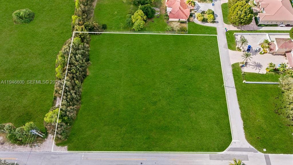 0 Stirling Road Southwest Ranches, FL 33331 - Photo 2 of 11 a view of a golf ground with large trees
