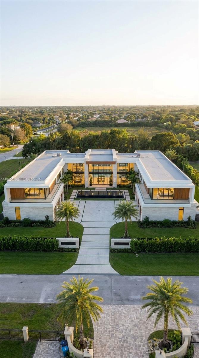 0 Stirling Road Southwest Ranches, FL 33331 - Photo 10 of 11 an aerial view of a house with a garden and lake view