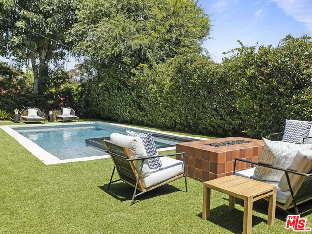 a view of a chairs and table in the patio
