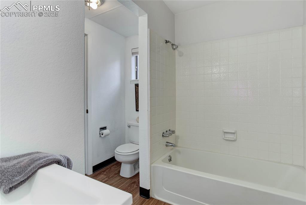 5102 Rainbow Harbour Circle Colorado Springs, CO 80917 - Photo 12 of 25 a bathroom with a sink a toilet and shower