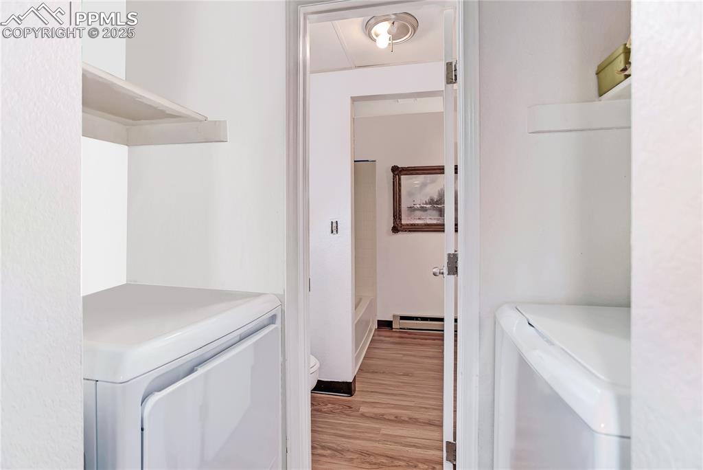 5102 Rainbow Harbour Circle Colorado Springs, CO 80917 - Photo 13 of 25 a view of a hallway with wooden floor