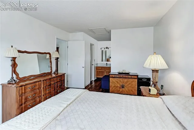 a bedroom with a bed and a fireplace