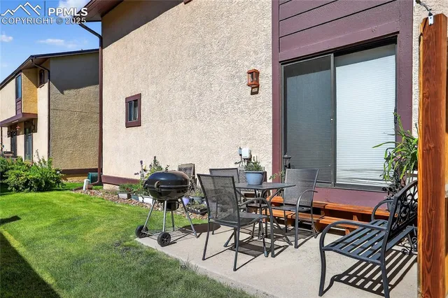 a view of backyard with wheel chair and a potted plant