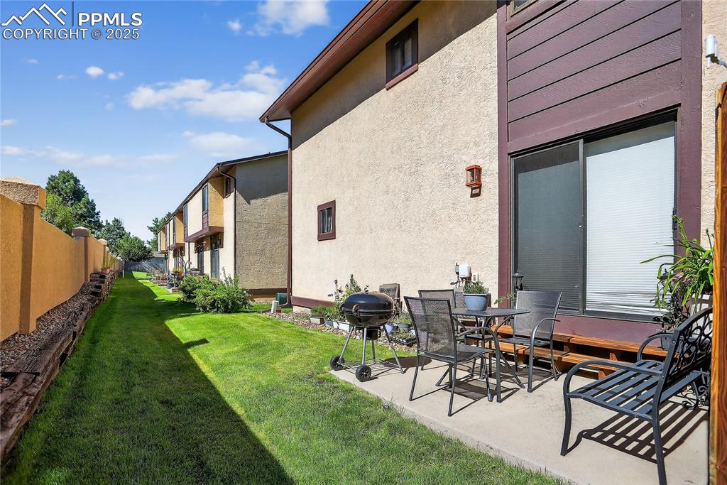5102 Rainbow Harbour Circle Colorado Springs, CO 80917 - Photo 24 of 25 a view of a patio with table and chairs and potted plants