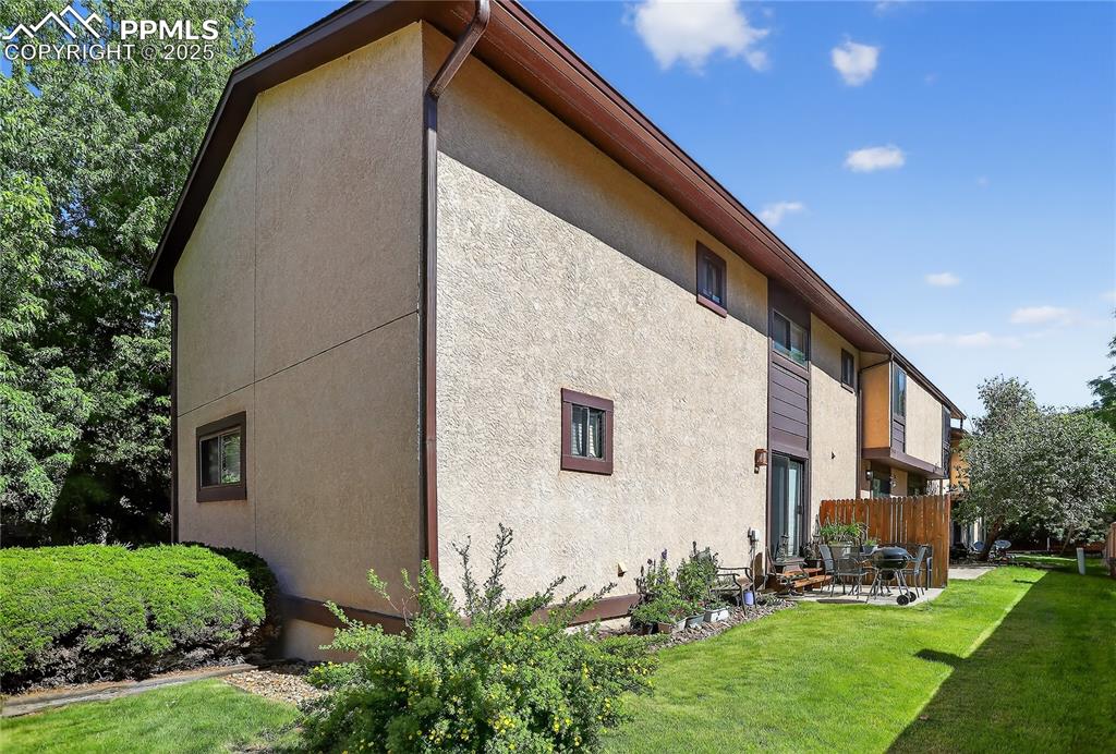 5102 Rainbow Harbour Circle Colorado Springs, CO 80917 - Photo 25 of 25 a backyard of a house with lots of green space