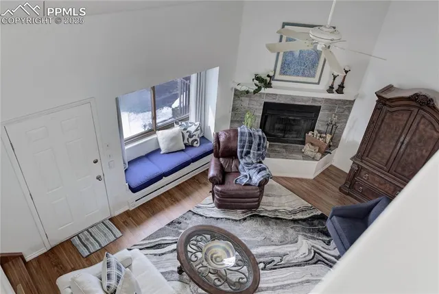 a living room with furniture and a fireplace