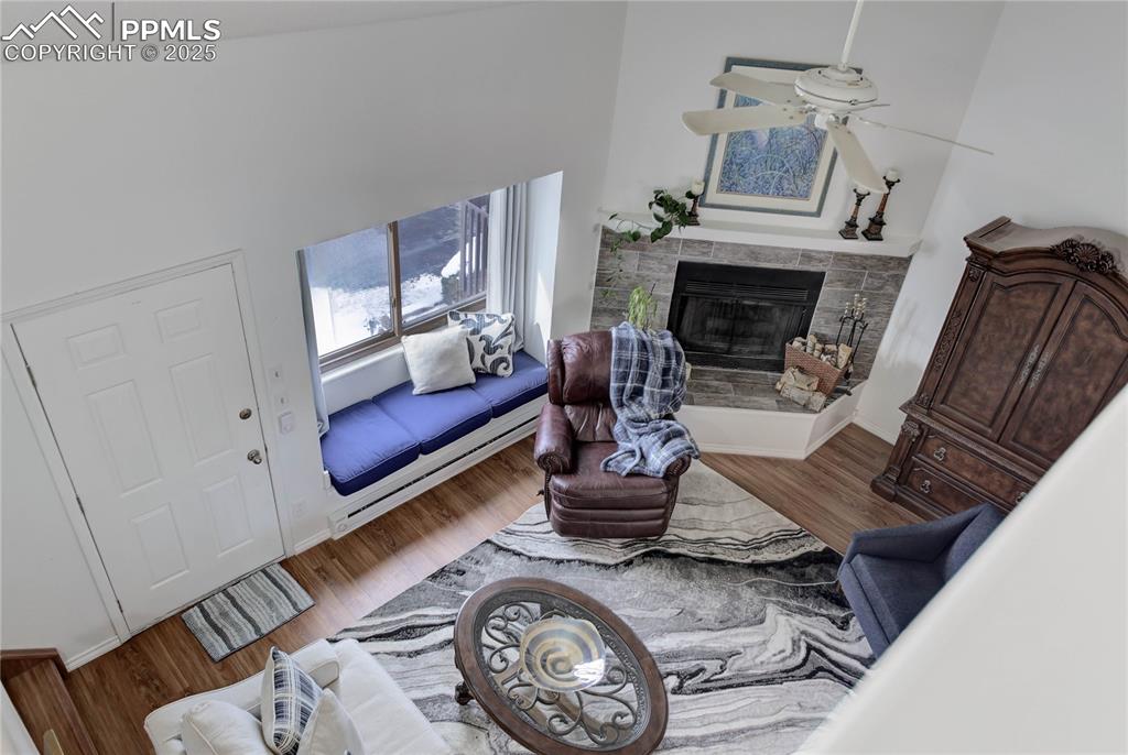 5102 Rainbow Harbour Circle Colorado Springs, CO 80917 - Photo 3 of 25 a living room with furniture and a fireplace