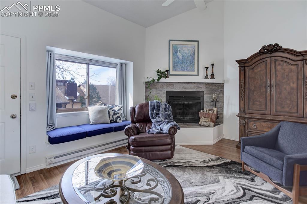 5102 Rainbow Harbour Circle Colorado Springs, CO 80917 - Photo 5 of 25 a living room with furniture and a fireplace
