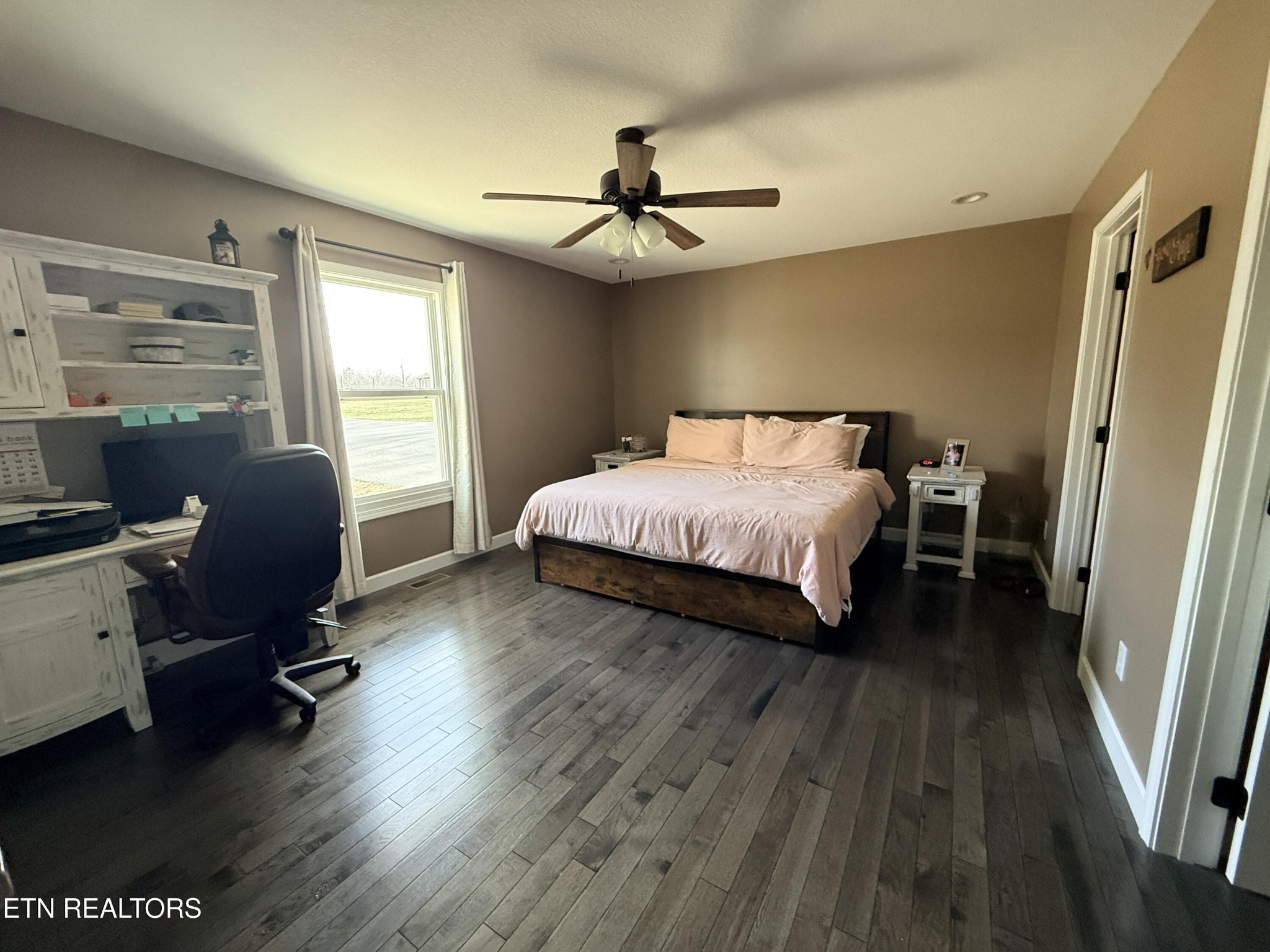 1926 Old Grimsley Road Grimsley, TN 38565 - Photo 17 of 41 a bedroom with a bed a desk and chair with wooden floor
