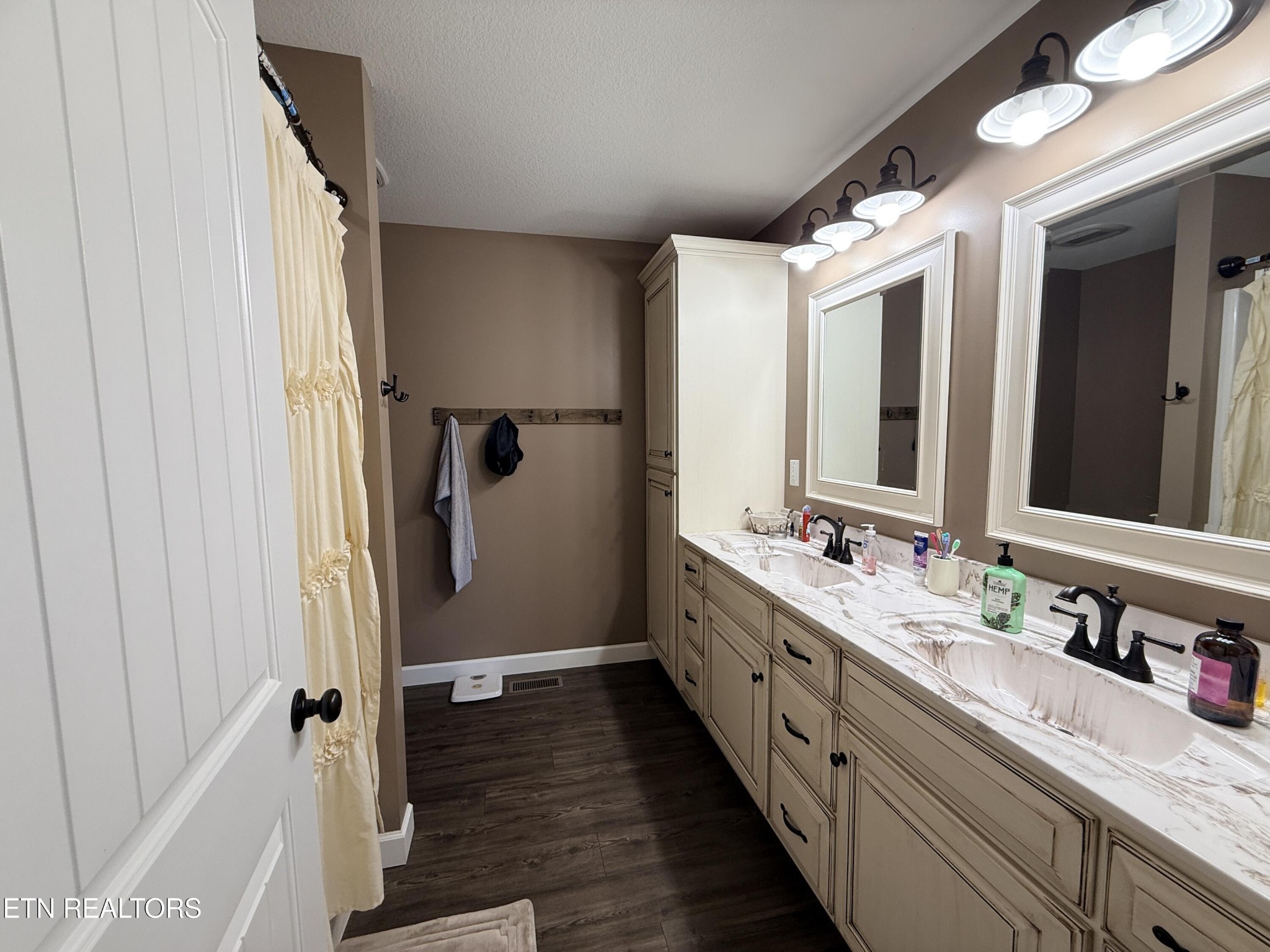 1926 Old Grimsley Road Grimsley, TN 38565 - Photo 22 of 41 a bathroom with a double vanity sink and mirror