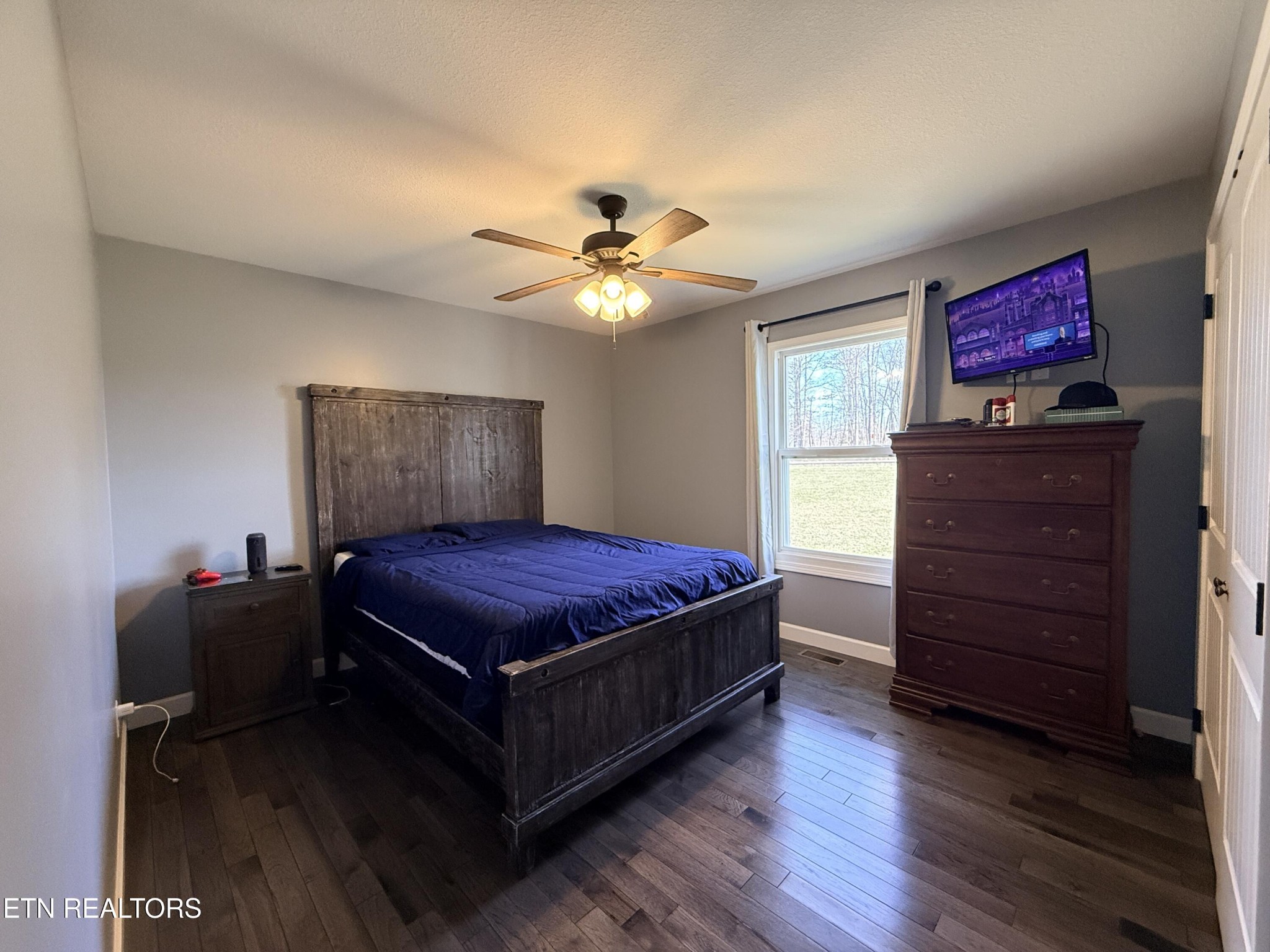 1926 Old Grimsley Road Grimsley, TN 38565 - Photo 25 of 41 a bedroom with a bed and wooden floor