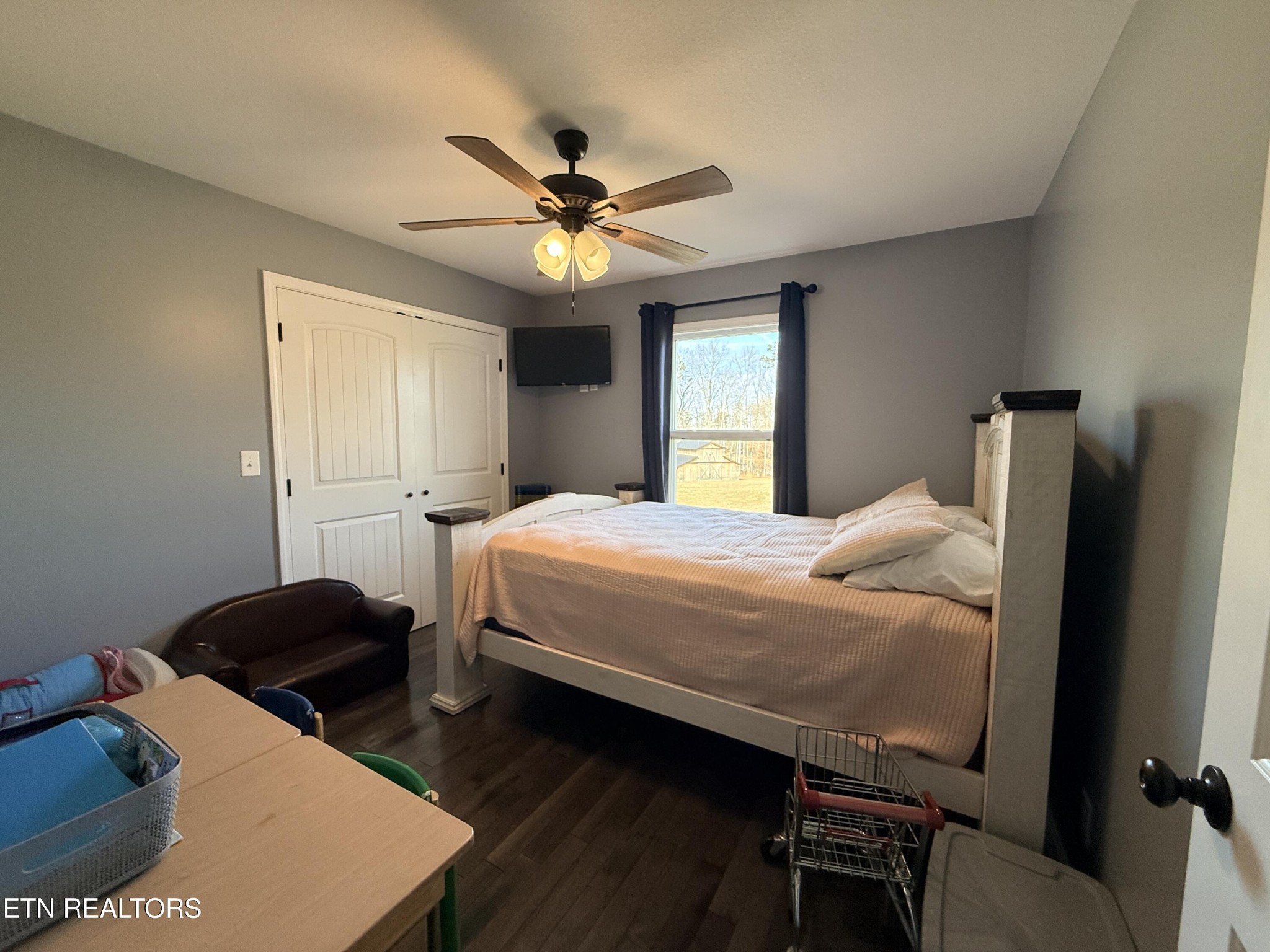 1926 Old Grimsley Road Grimsley, TN 38565 - Photo 26 of 41 a bedroom with a bed a window and a chandelier
