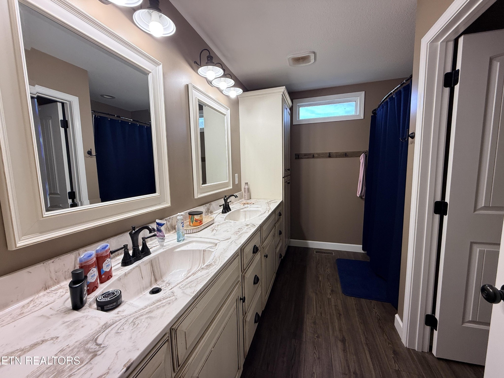 1926 Old Grimsley Road Grimsley, TN 38565 - Photo 28 of 41 a bathroom with a double vanity sink a mirror and a shower
