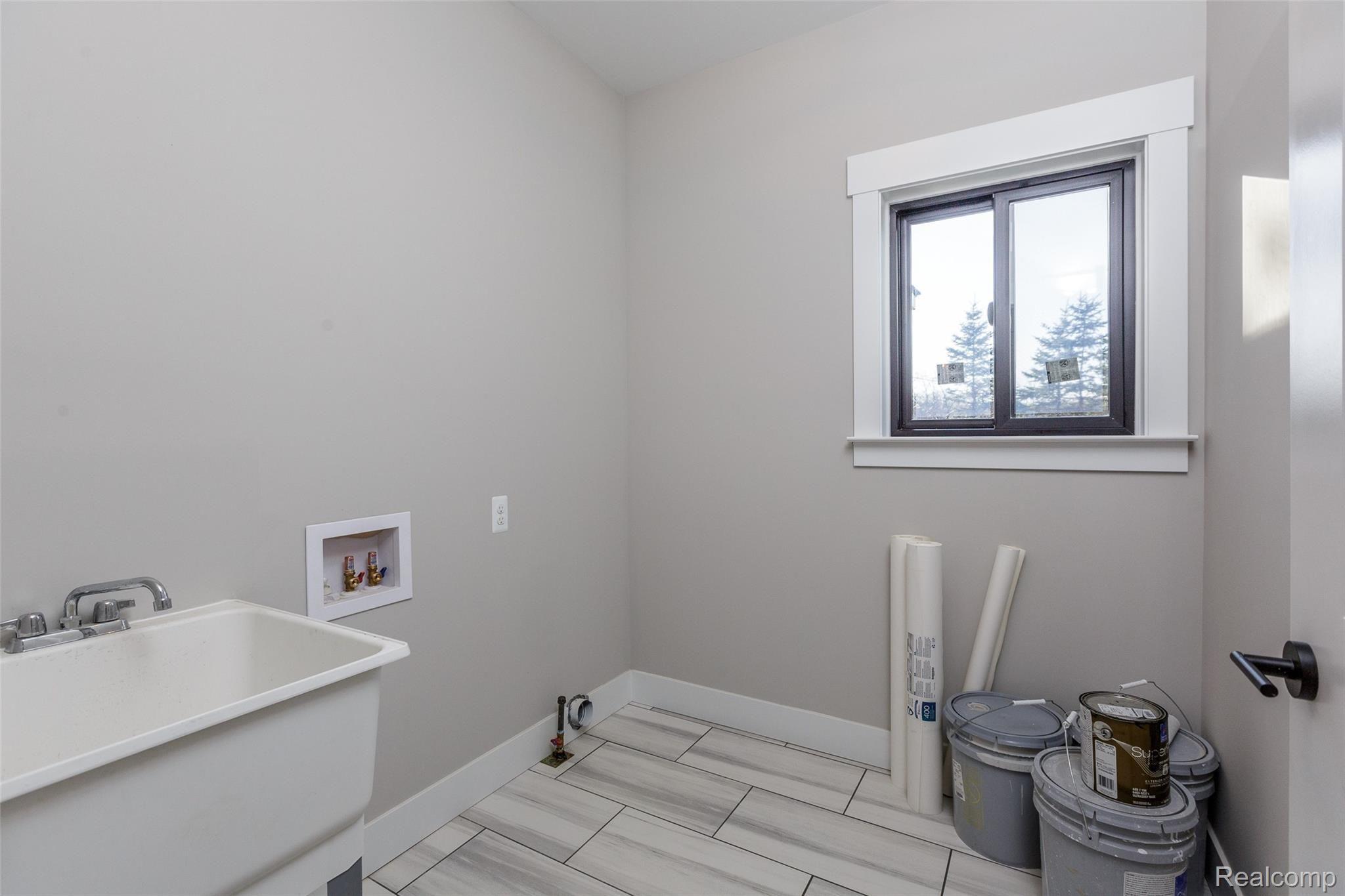 5375 Rochester Road Leonard, MI 48367 - Photo 34 of 49 Laundry Room, Ceramic Flooring