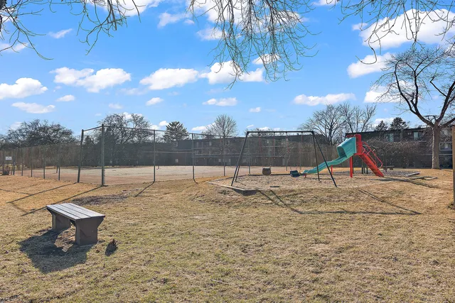 a view of an house with backyard and a patio