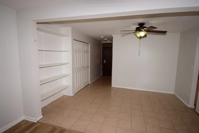 a view of a chandelier fan in a room