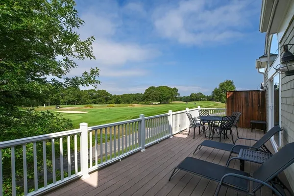 a view of a chairs and table in the balcony