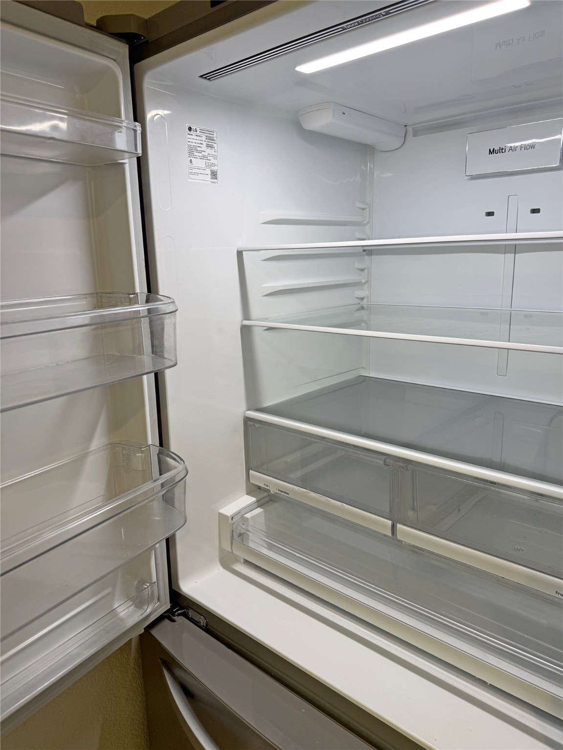 91 Willow Oak Lane Point Blank, TX 77364 - Photo 13 of 27 a refrigerator in a kitchen