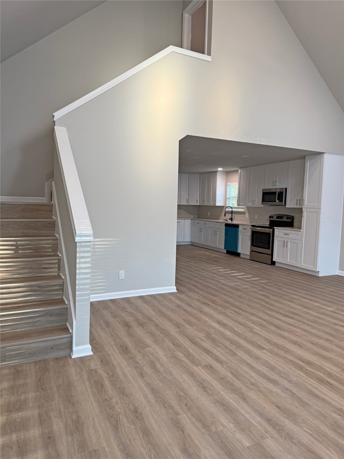 91 Willow Oak Lane Point Blank, TX 77364 - Photo 15 of 27 a view of a kitchen with furniture and wooden floor