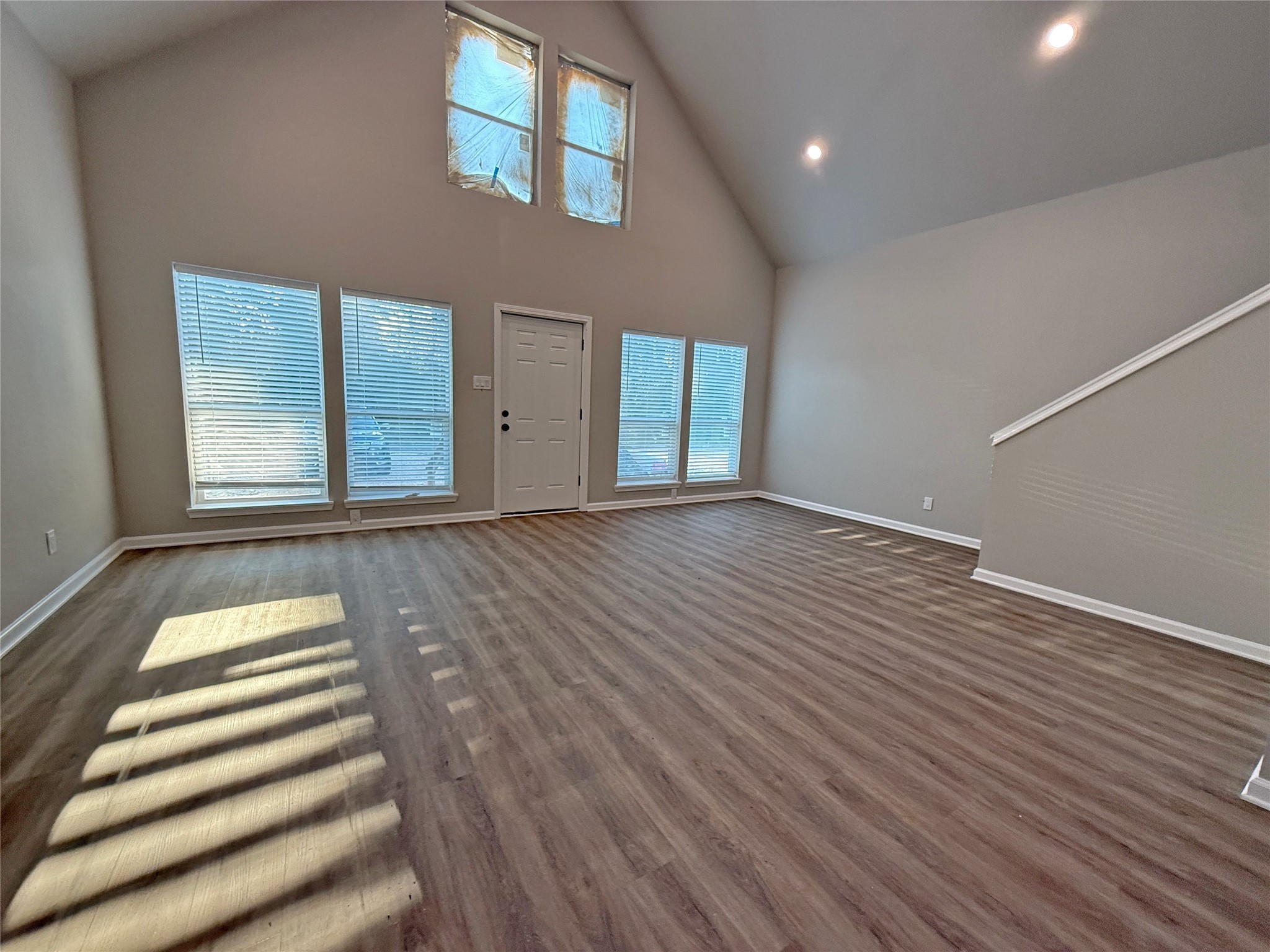 91 Willow Oak Lane Point Blank, TX 77364 - Photo 2 of 27 a view of an empty room with wooden floor and a window