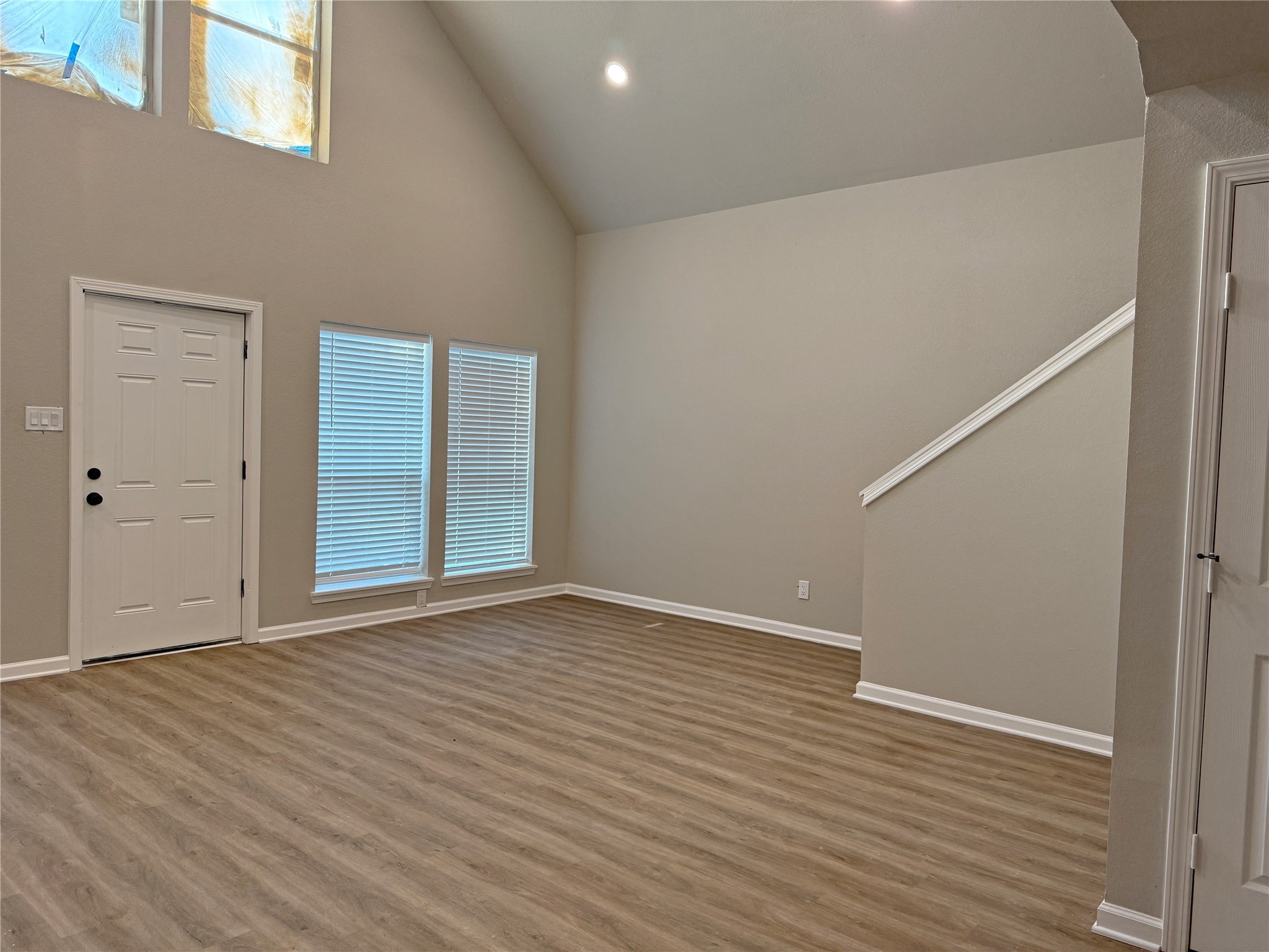 91 Willow Oak Lane Point Blank, TX 77364 - Photo 4 of 27 an empty room with wooden floor and windows