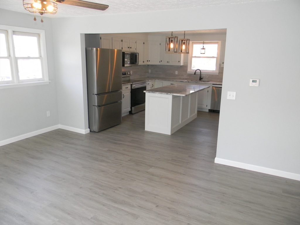 1 Lenox Street Athol, MA 01331 - Photo 11 of 37 a kitchen with stainless steel appliances granite countertop a refrigerator and a sink