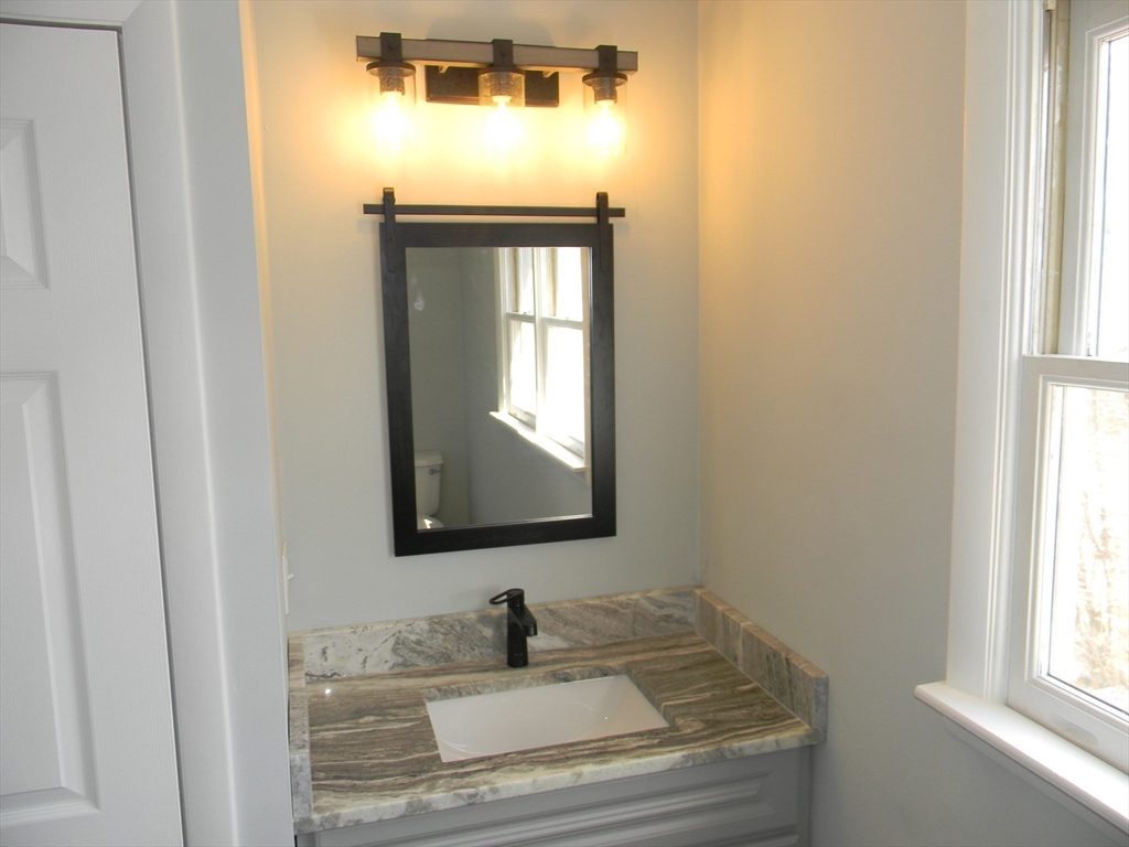 1 Lenox Street Athol, MA 01331 - Photo 22 of 37 a bathroom with a sink and a mirror