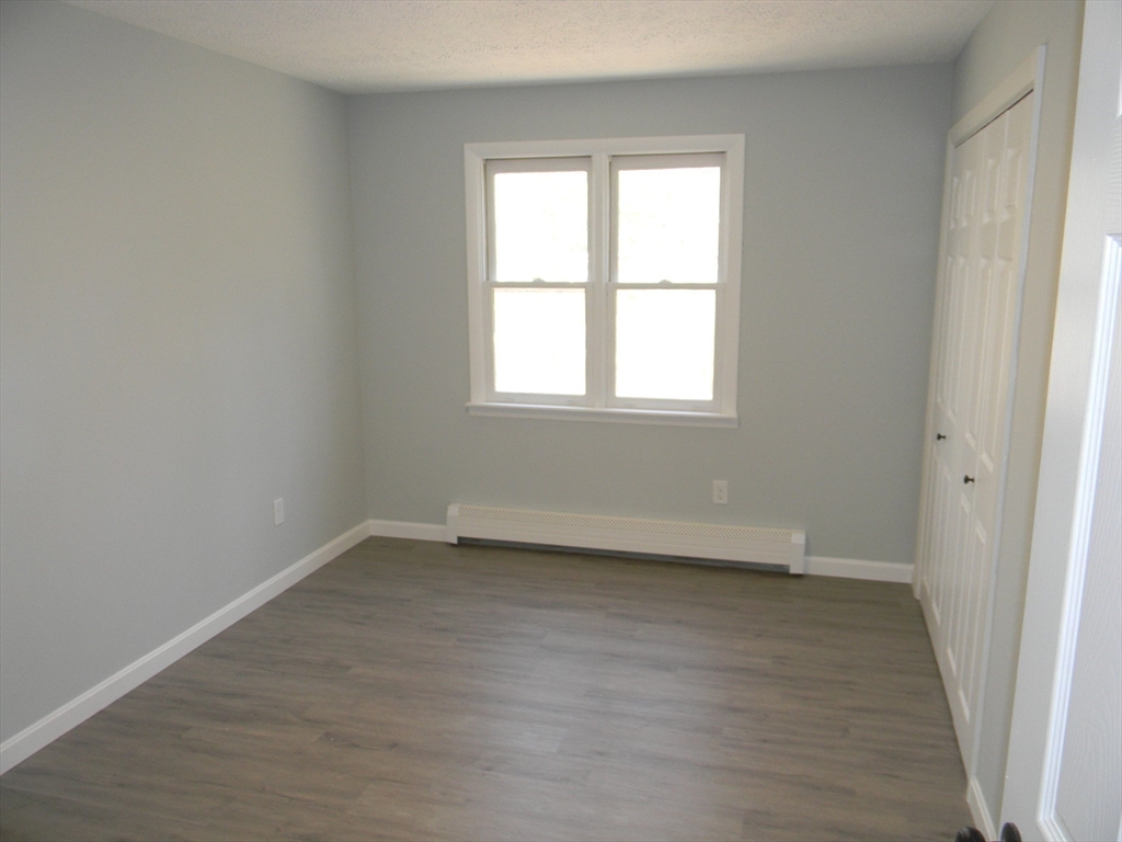 1 Lenox Street Athol, MA 01331 - Photo 26 of 37 an empty room with wooden floor and windows