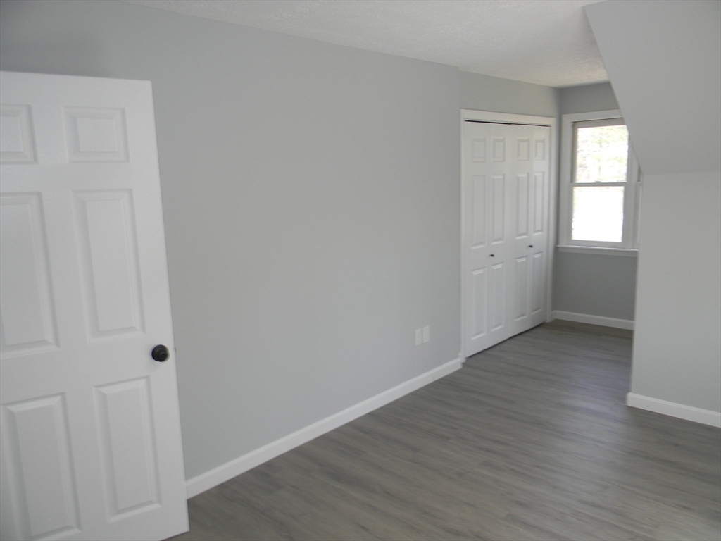 1 Lenox Street Athol, MA 01331 - Photo 27 of 37 a view of an empty room with wooden floor and a window