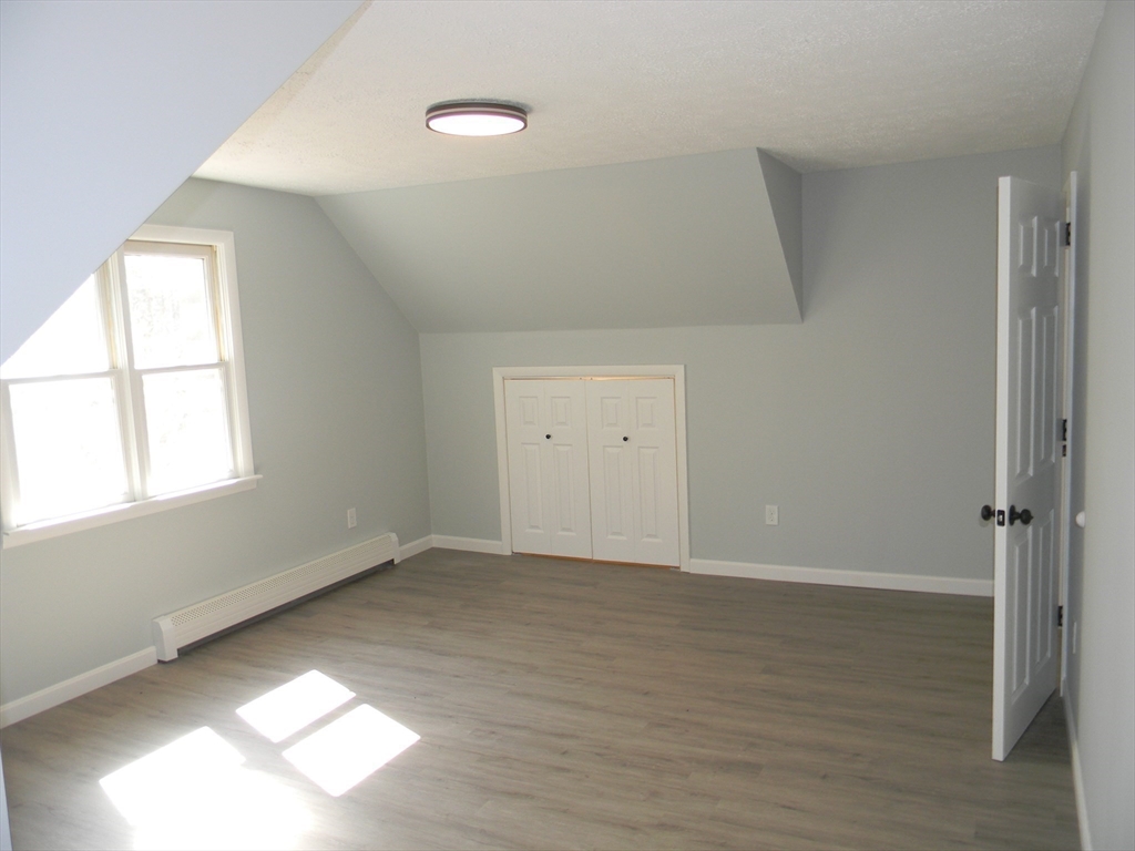 1 Lenox Street Athol, MA 01331 - Photo 28 of 37 an empty room with wooden floor and windows