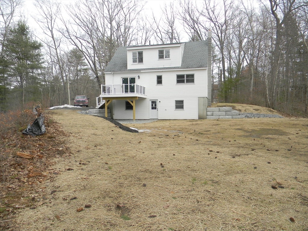 1 Lenox Street Athol, MA 01331 - Photo 35 of 37 a view of a white house with a yard covered in snow