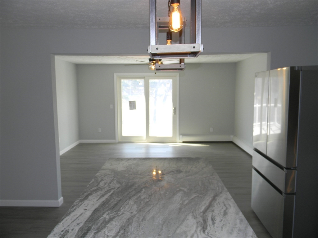 1 Lenox Street Athol, MA 01331 - Photo 6 of 37 an empty room with windows and cabinet