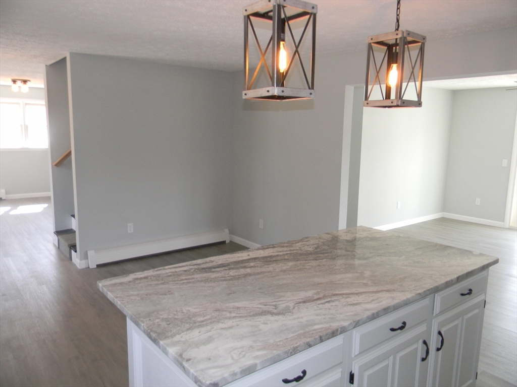 1 Lenox Street Athol, MA 01331 - Photo 7 of 37 an empty room with wooden floor and window