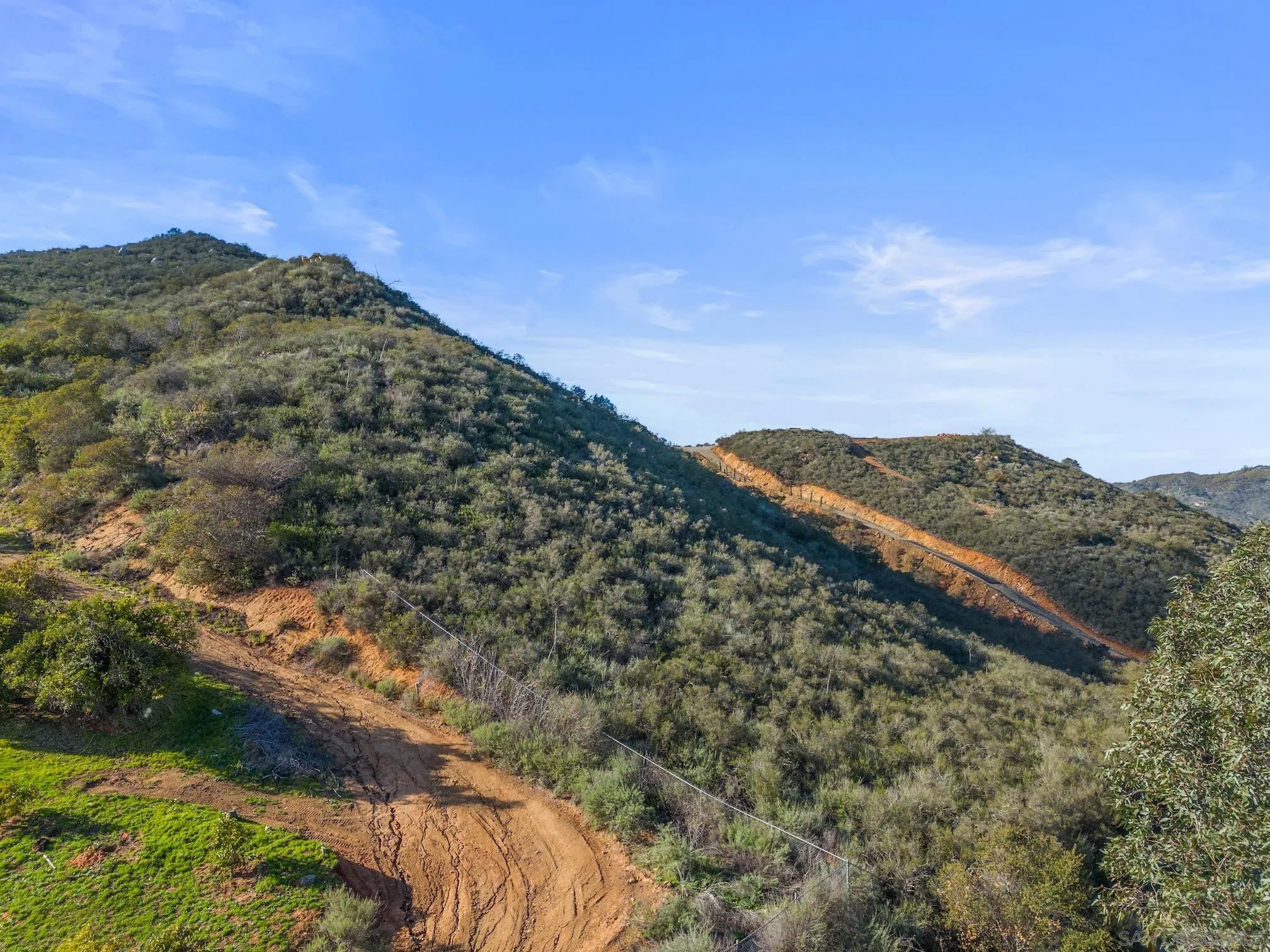 555 Calle Jardin, Unit 1 Temecula, CA 92590 - Photo 15 of 22 a view of a large building with mountains in the background